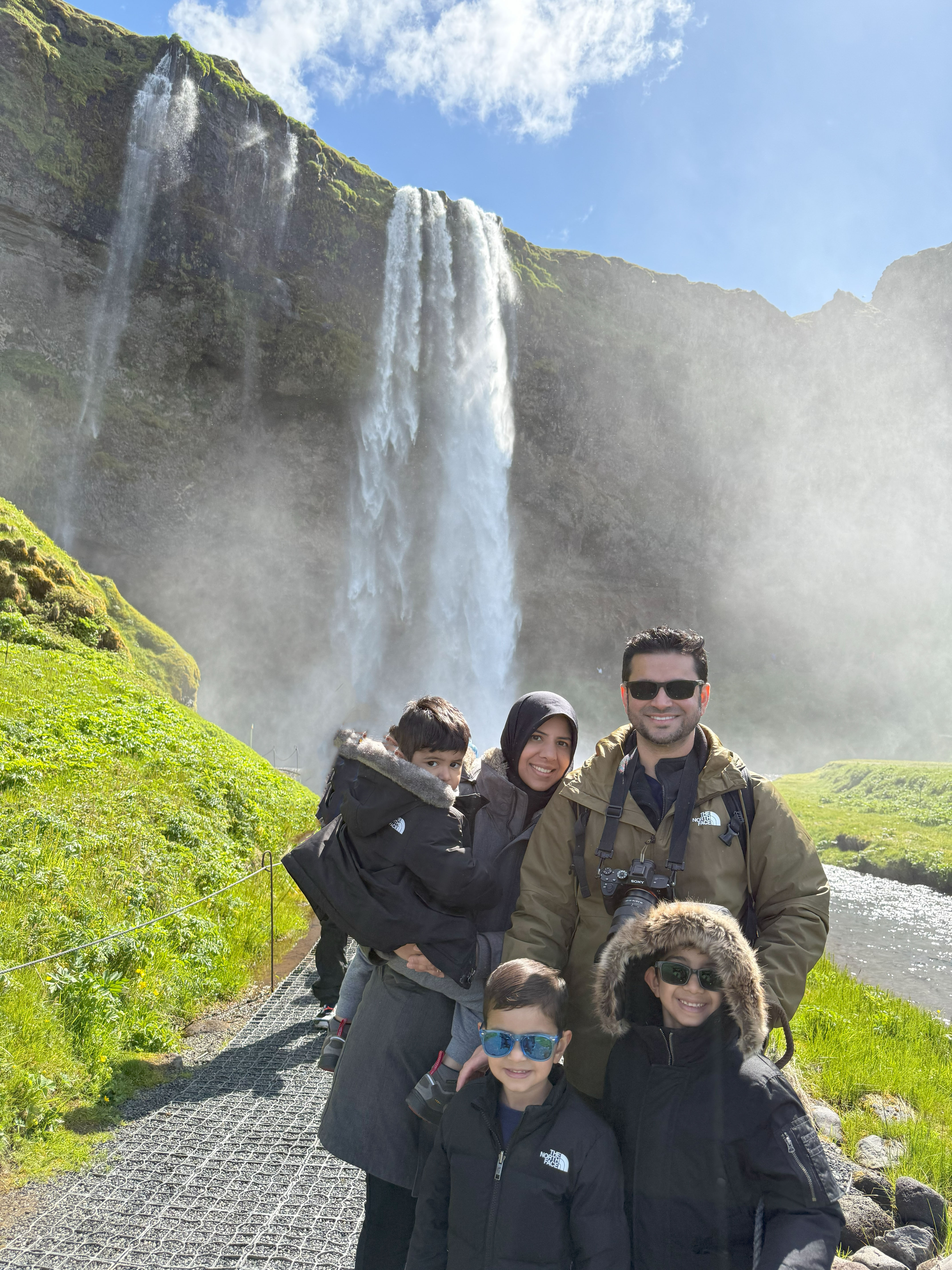 Family picture in front of Seljalandsfoss in Southern Iceland